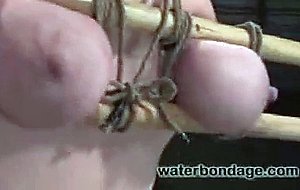 Busty blonde beauty is bound, gagged and tormented with water.