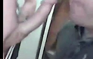 Guy blows and swallows in a public washroom
