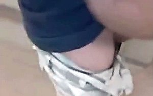 Guy blows and swallows in a public washroom