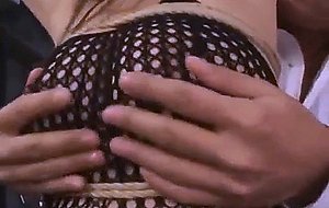 Megu busty in fishnet lingerie gets sex toy in asshole