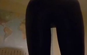 Crossdresser in shiny leggings tease