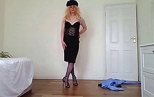 Stripping out of a police uniform with black basque