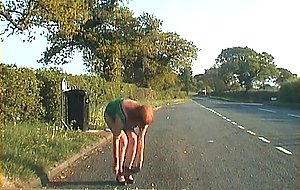 Mature shemale walking on a road