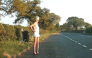 Mature shemale walking on a road