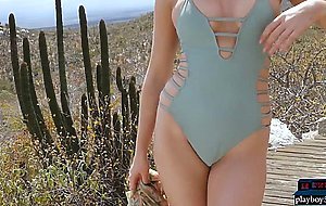 Sexy blonde MILF Ali Claire gives a striptease outdoor