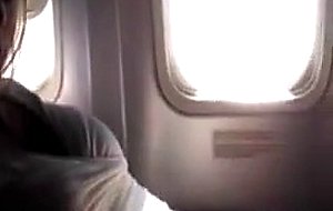 Masturbating her pussy in the airplane - free porn