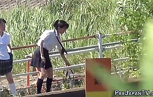 Goldenshower teens peeing outdoors 