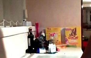 Emo teen fingers her pussy in kitchen