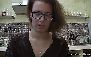 Solo girl with glasses chatting in the kitchen