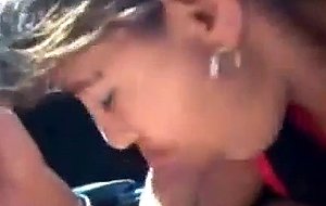 Brunette slut sucks cock in a car