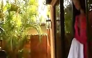 Sexy milf tanning by the pool