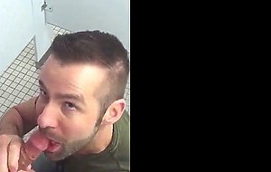 Handsome guy sucks dick in restroom stall