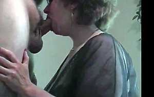 Busty grandma with glasses gives head and gets cum