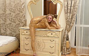 Gymnastic, ballerina in a golden dress