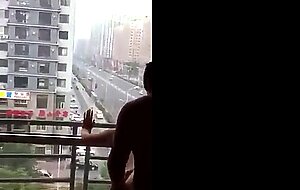 Filming his girl gets fucked at open window