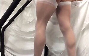 Crossdresser in White Stockings on Treadmill