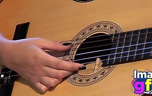 Hot Paul showing her medium tits and pussy with guitar