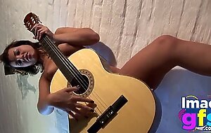 Hot Paul showing her medium tits and pussy with guitar