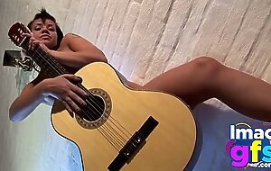 Hot Paul showing her medium tits and pussy with guitar