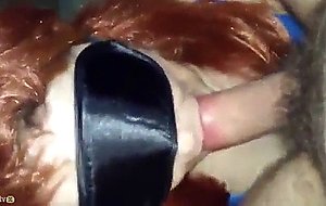 Redhead wife has oral sex with a mask