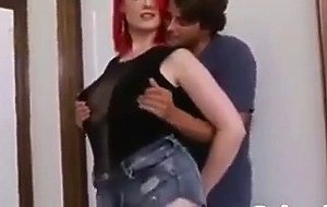 Busty girl with bright red hair