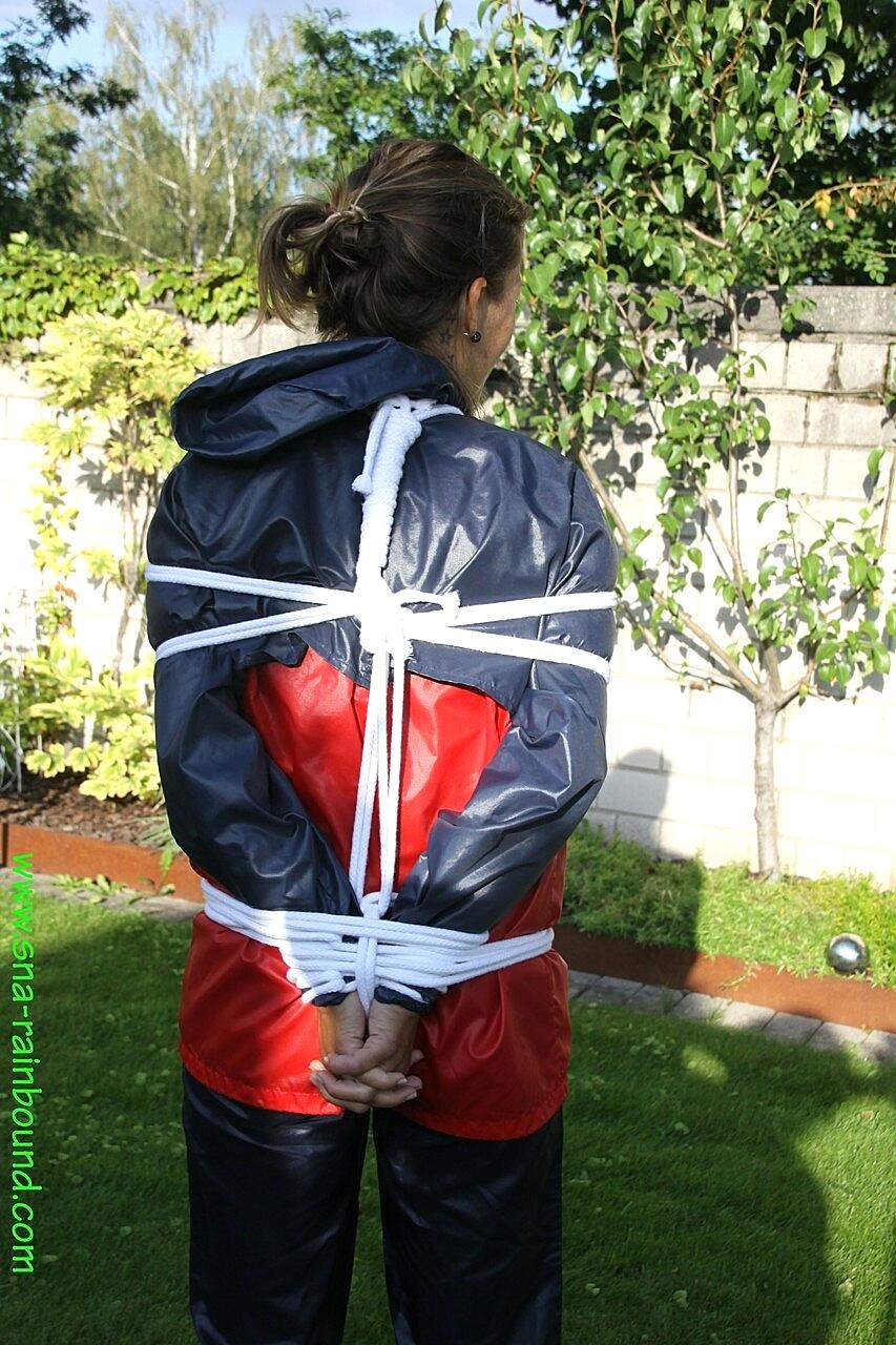 Submissive Woman Sandra Is Tied Up While Wearing A Raincoat In A Sunny Yard Amateur, Bdsm, Blindfold, Clothed, Outdoor