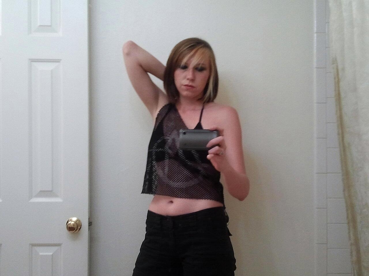 Amateur girl Kacie Montes stripping and posing naked in the mirror