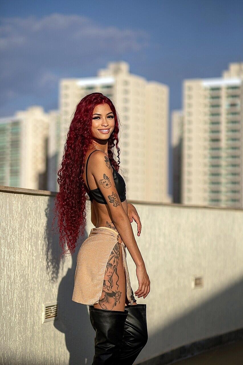 Teen Latina redhead Renata Lima exposes her firm ass and poses in hot lingerie